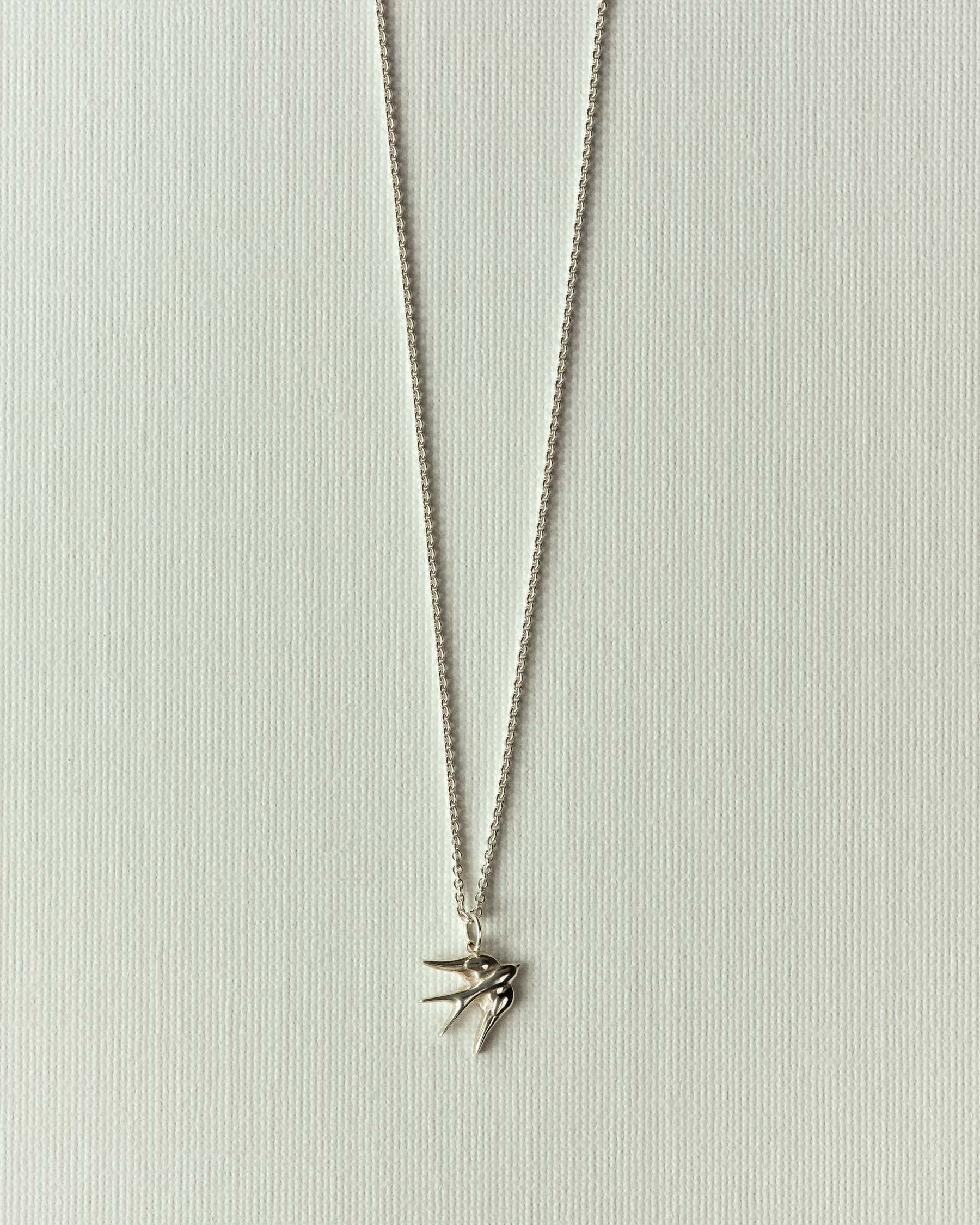 Embossed swallow necklace