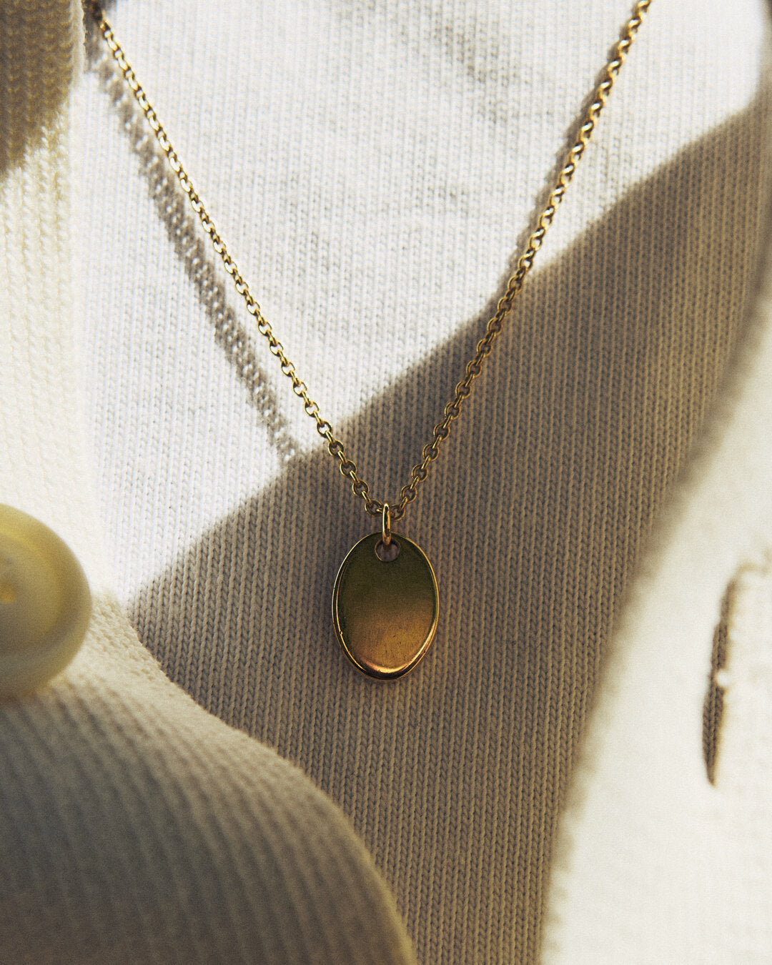Thick oval medal necklace
