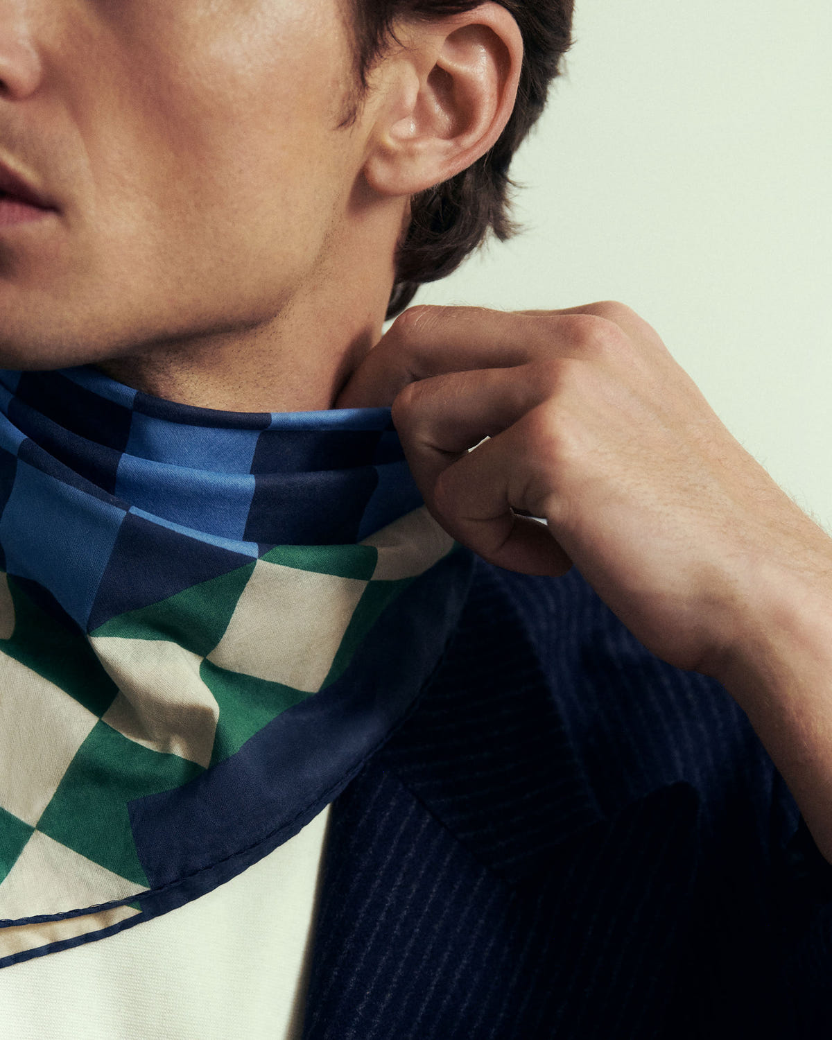 Close-up of the silk gathered at the neck, blue and green checks, navy edge