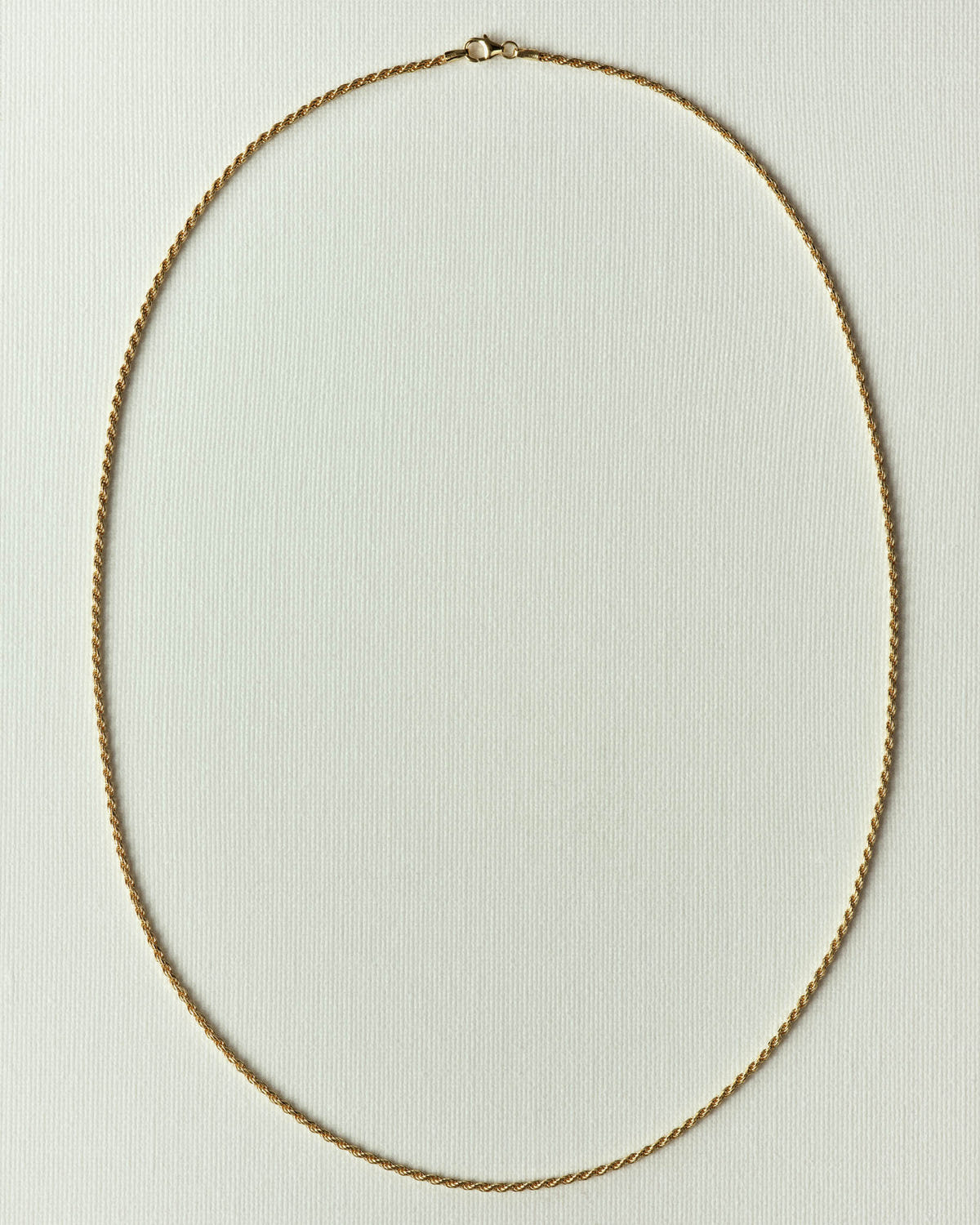 The same in gold, even twist and lobster clasp
