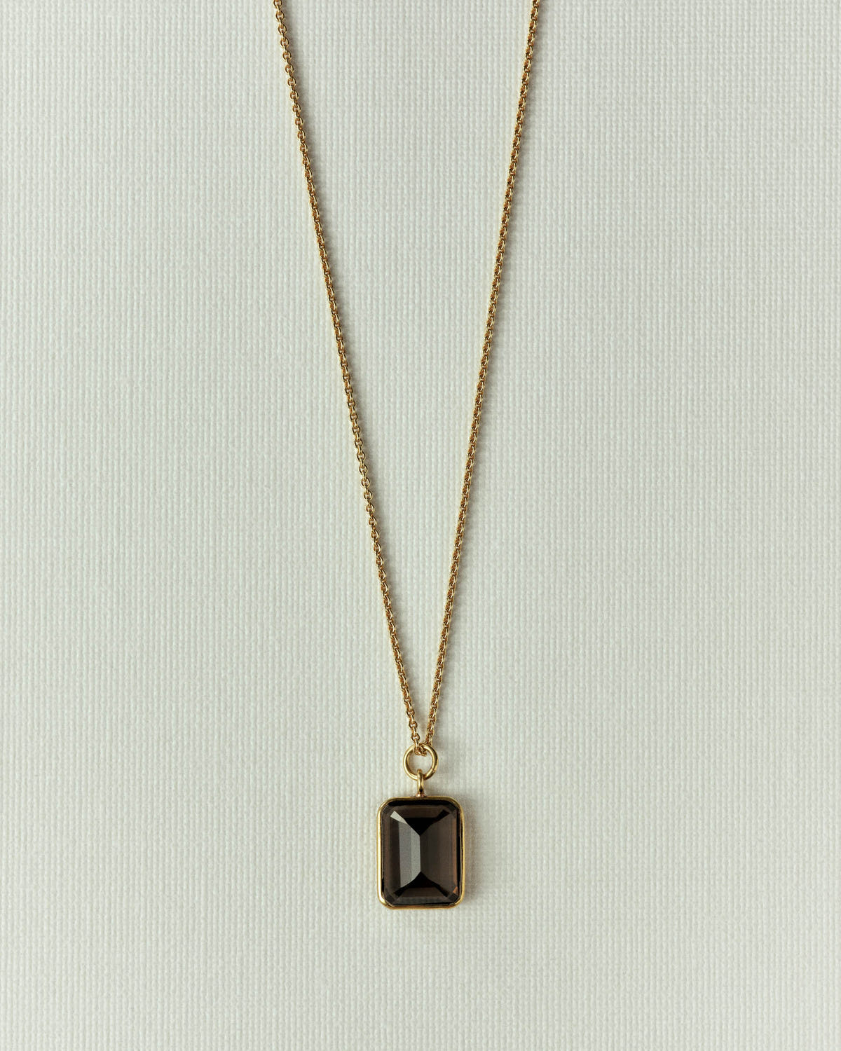 The same pendant in smoky brown stone, gold setting and fine chain