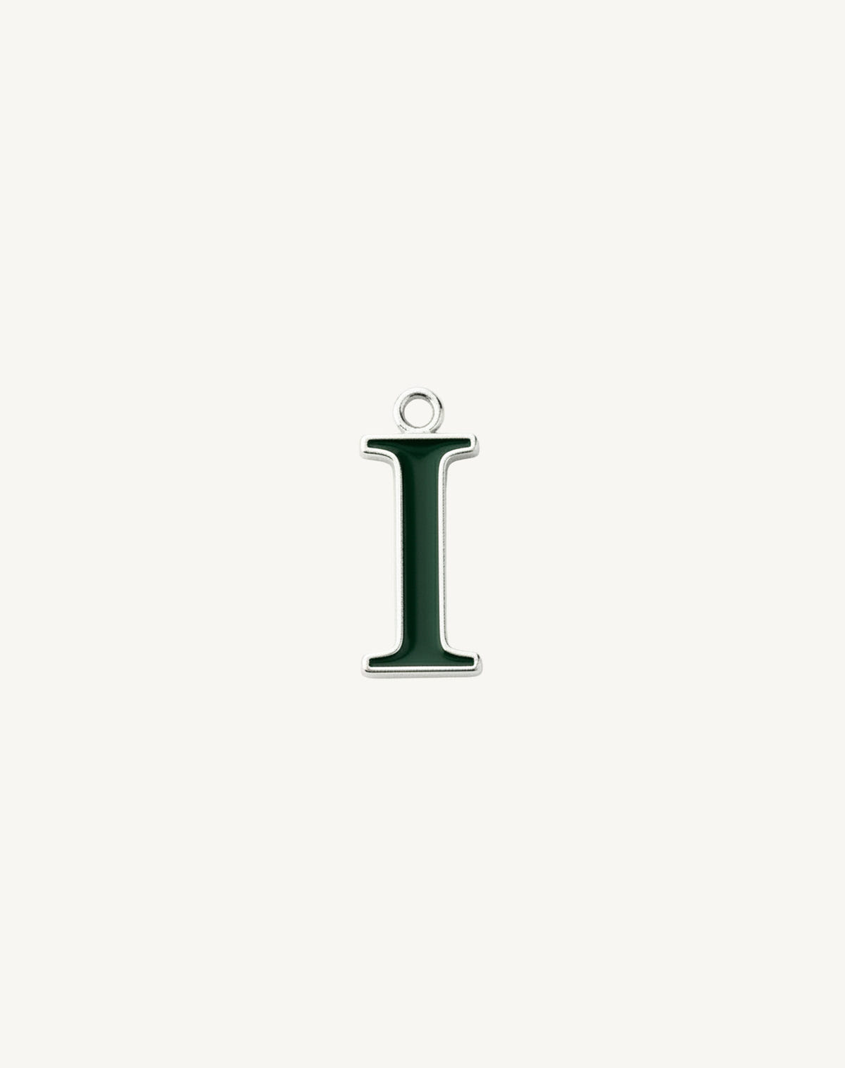 Narrow serif letter I, dark green enamel edged in silver, cream background