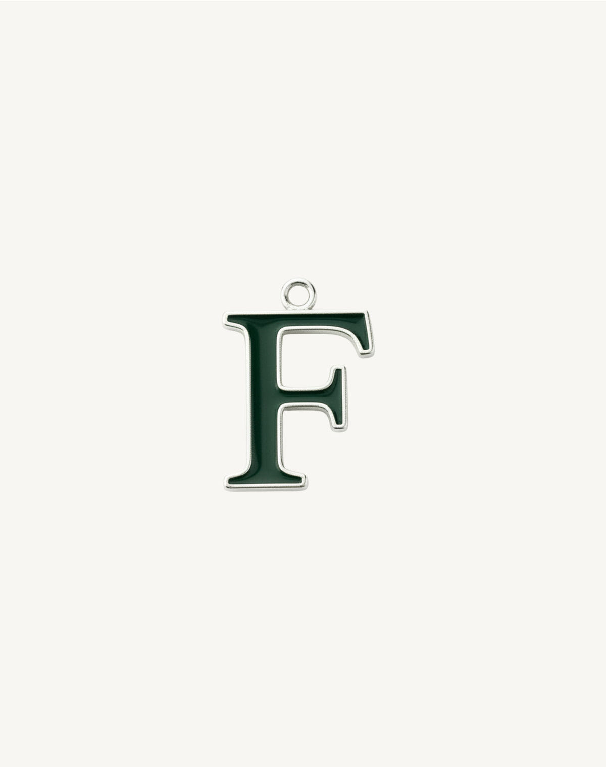 F pendant in dark green enamel, serifs picked out in silver, small ring at the top