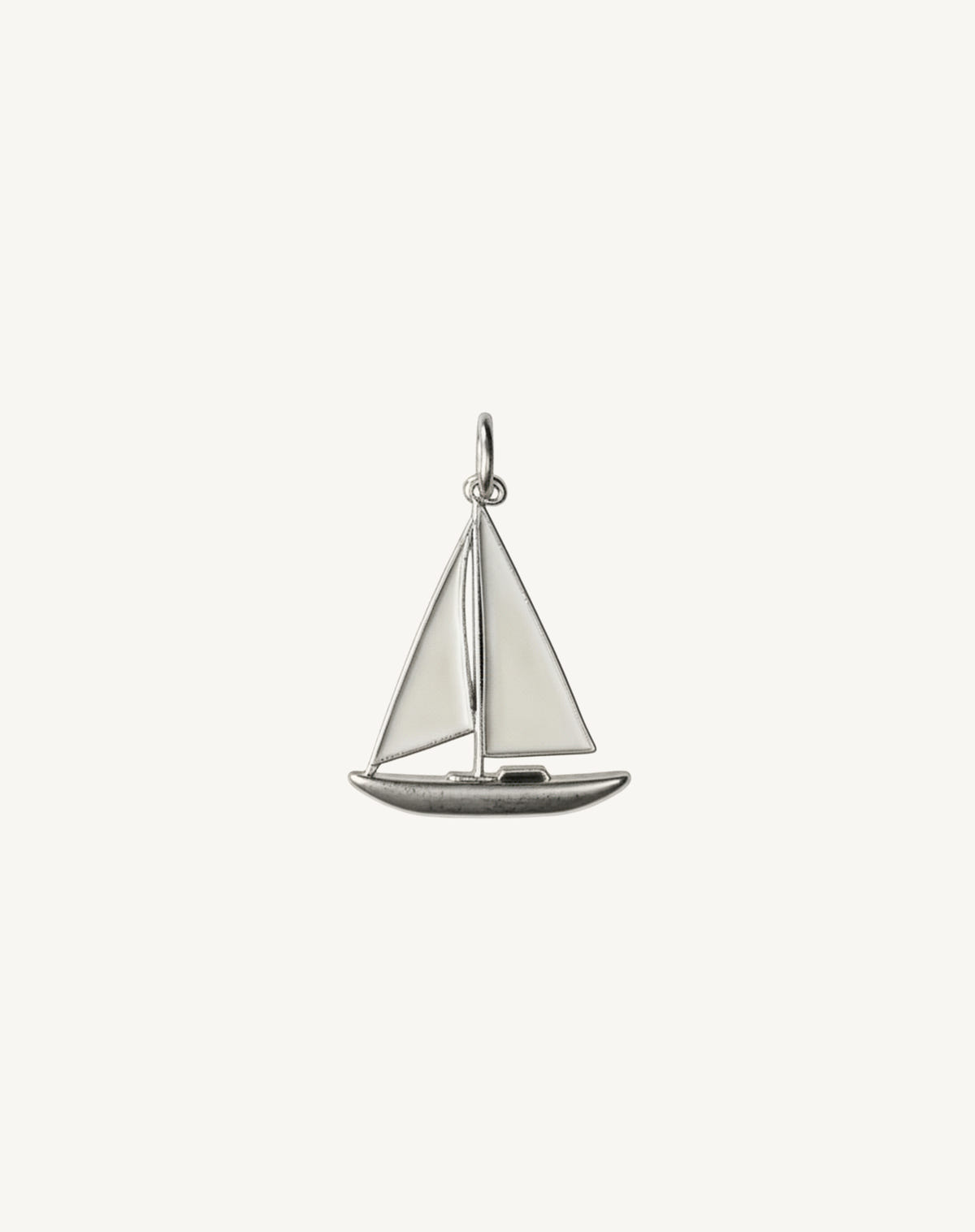 The same in silver, ivory enamel sails and a polished hull