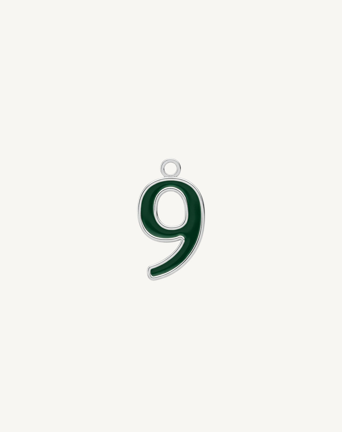 Nine with a curved tail, dark green enamel and a silver border on cream