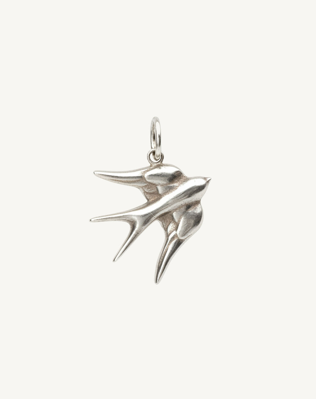 Embossed swallow charm